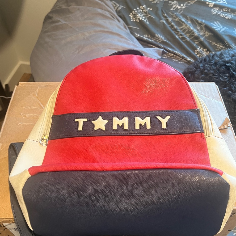 15. Tommy Hilfiger Leather Red, White and Blue Backpack with Blue Logo Patch